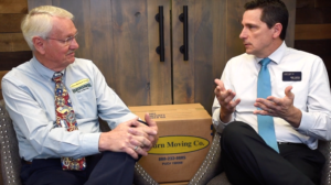 bruce cosgrove talks with real estate agent about moving companies